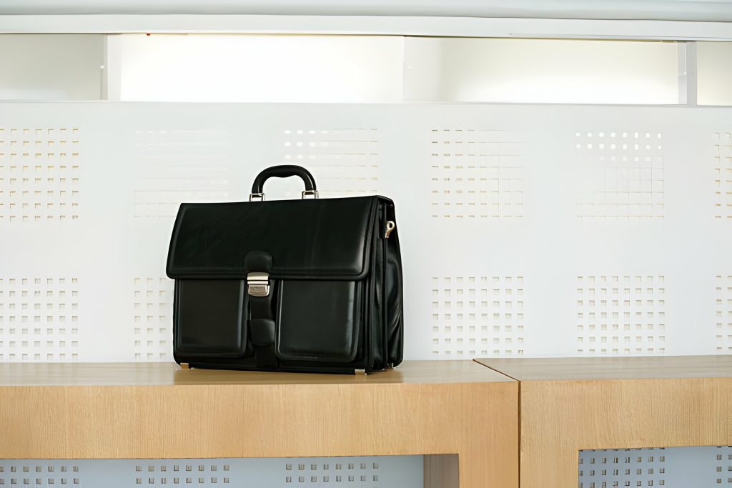 Black leather laptop backpack with spacious compartments for organization and style.